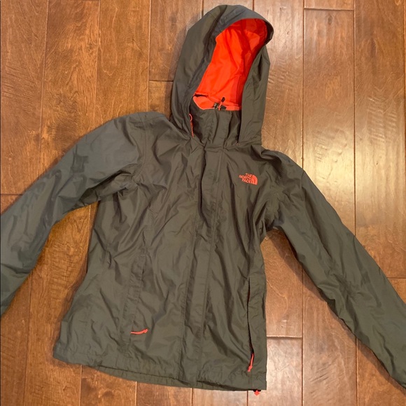 green and orange north face jacket